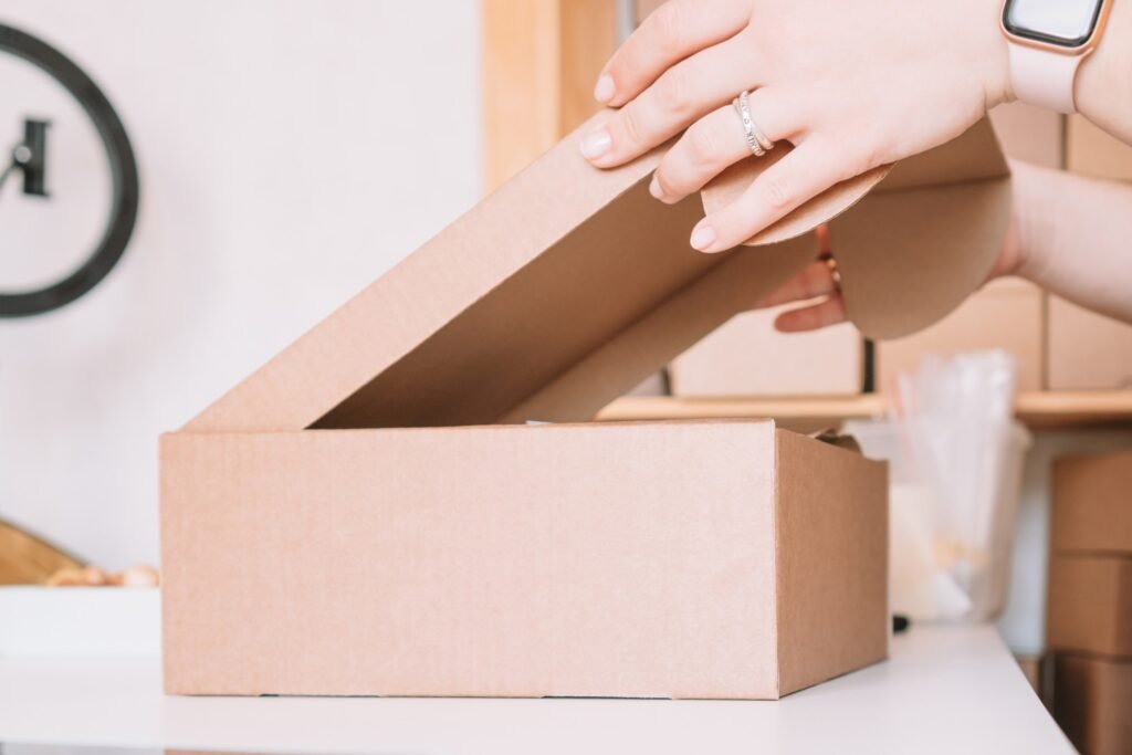 woman hands packing, preparing parcel for delivery package to customers. Small business owner, individual entrepreneur in workshop, startup. Online order